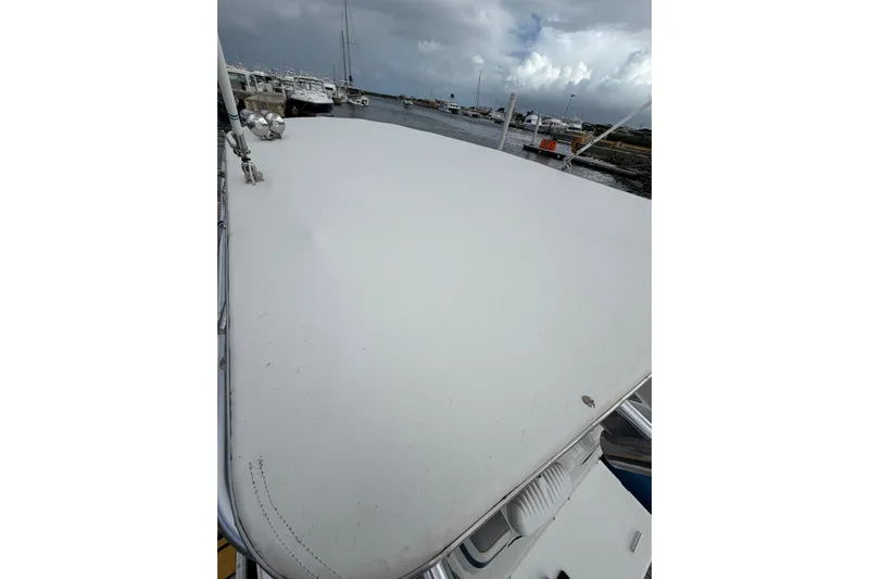  Yacht Photos Pics 2007 Fountain 38 Tournament Edition boat deck with marina view under cloudy sky.