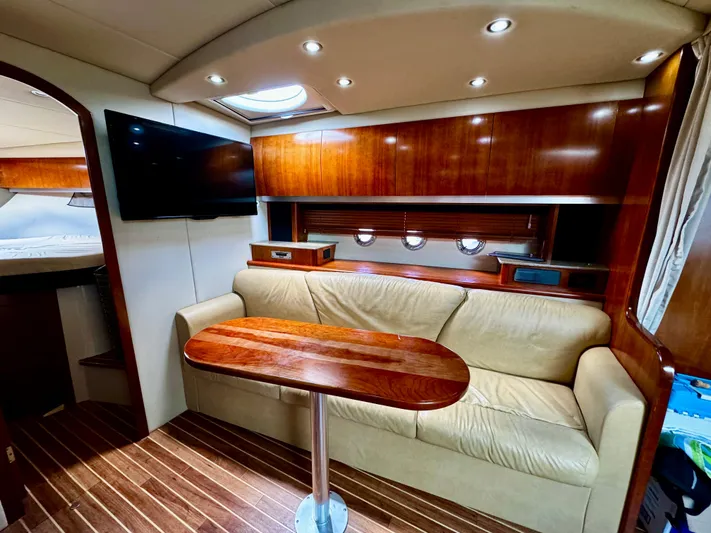  Yacht Photos Pics Luxurious interior of 2008 Cruisers Yachts 390 Sports Coupe with leather seating and wood finishes.