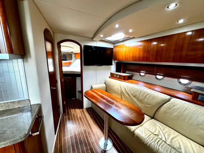  Yacht Photos Pics Luxurious interior of 2008 Cruisers Yachts 390 Sports Coupe with wood finishes and modern amenities.