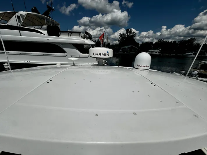  Yacht Photos Pics 2008 Cruisers Yachts 390 Sports Coupe with Garmin and Raymarine equipment, docked under cloudy sky.