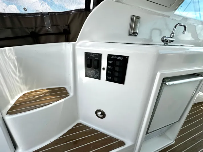  Yacht Photos Pics 2008 Cruisers Yachts 390 Sports Coupe interior with control panel and sink.