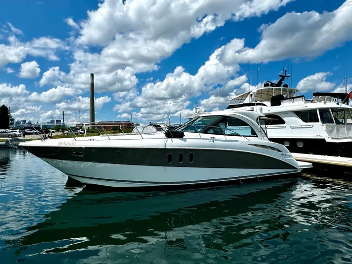  Yacht Photos Pics 2008 Cruisers Yachts 390 Sports Coupe docked under a vibrant blue sky.