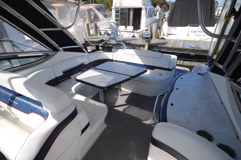  Yacht Photos Pics 2017 Formula 370 Super Sport yacht interior with white seating and table at marina.