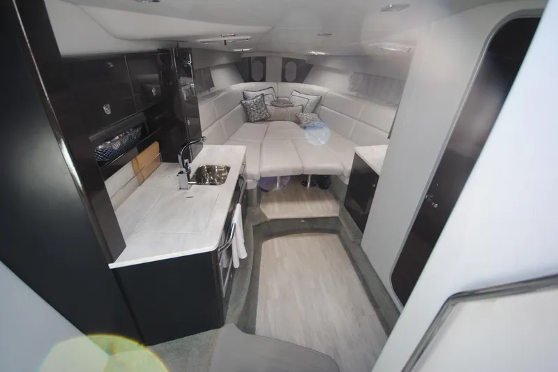  Yacht Photos Pics 2017 Formula 370 Super Sport interior with modern kitchen and cozy seating area.