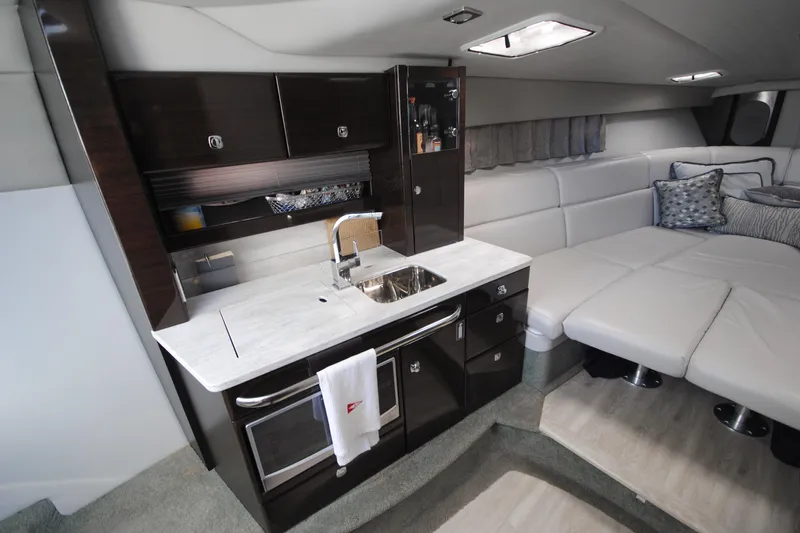  Yacht Photos Pics Luxurious interior of 2017 Formula 370 Super Sport yacht with modern kitchen and seating area.