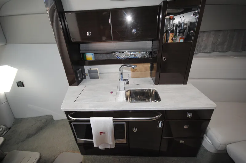  Yacht Photos Pics 2017 Formula 370 Super Sport yacht interior kitchen with sink and storage cabinets.