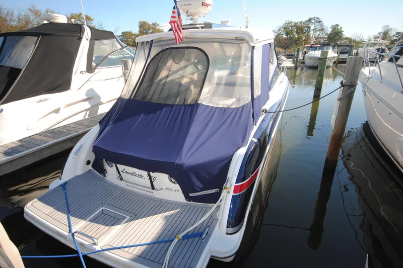  Yacht Photos Pics 2017 Formula 370 Super Sport boat docked with blue cover and American flag.