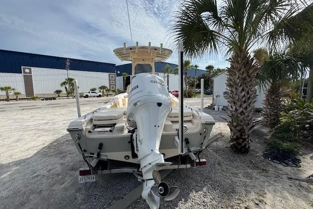  Yacht Photos Pics 2021 Grady-White 251 Coastal Explorer boat with Yamaha engine, parked near palm trees.