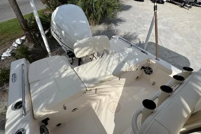  Yacht Photos Pics 2021 Grady-White 251 Coastal Explorer boat interior with seating and motor.