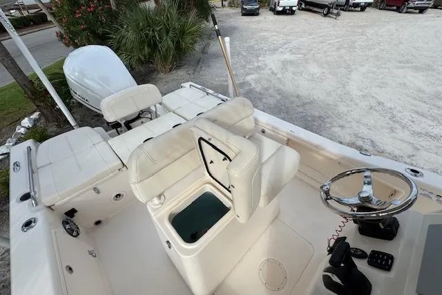  Yacht Photos Pics 2021 Grady-White 251 Coastal Explorer boat interior with seating and steering wheel.