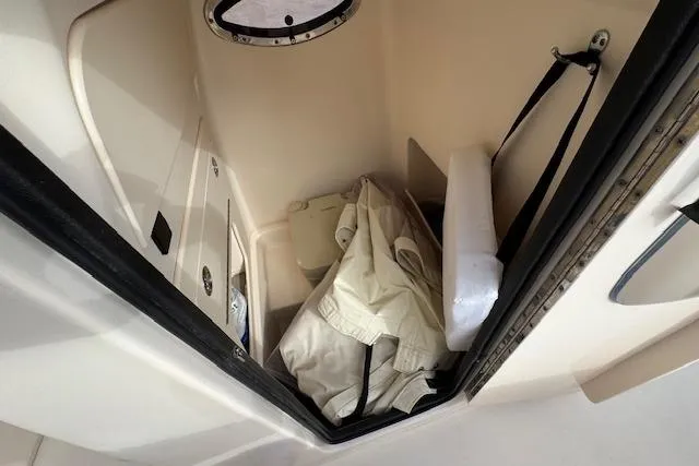  Yacht Photos Pics 2021 Grady-White 251 Coastal Explorer storage compartment with gear and equipment.