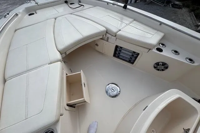  Yacht Photos Pics 2021 Grady-White 251 Coastal Explorer boat interior with cushioned seating and storage compartments.