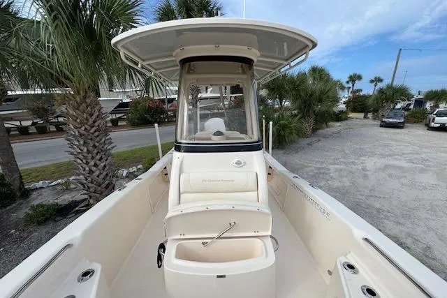  Yacht Photos Pics 2021 Grady-White 251 Coastal Explorer boat, center console, parked near palm trees.