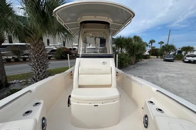  Yacht Photos Pics 2021 Grady-White 251 Coastal Explorer boat, spacious deck, palm trees in background.