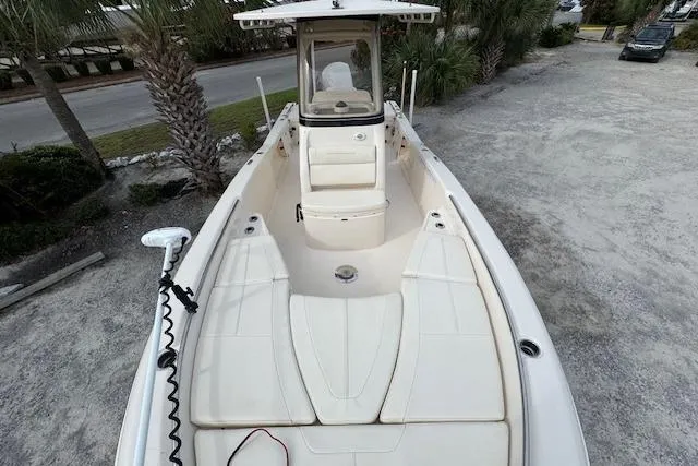  Yacht Photos Pics 2021 Grady-White 251 Coastal Explorer boat, top view, parked on gravel near palm trees.