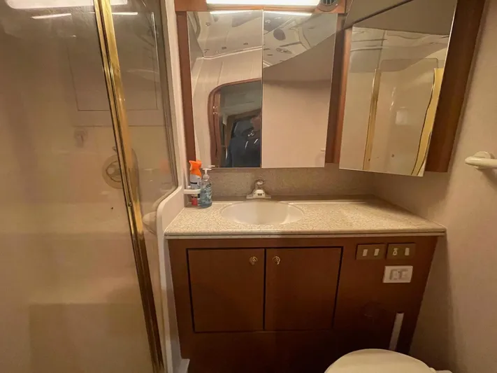 End Game Yacht Photos Pics Bathroom interior of 2001 Ocean Yachts 56 Super Sport with vanity and shower.