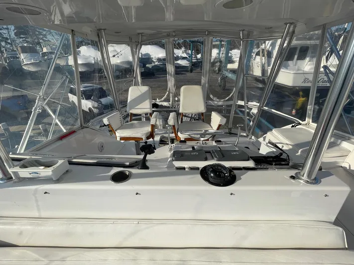 End Game Yacht Photos Pics 2001 Ocean Yachts 56 Super Sport yacht cockpit with helm and seating area.