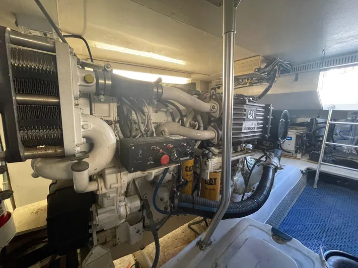 End Game Yacht Photos Pics Engine room of 2001 Ocean Yachts 56 Super Sport, featuring Caterpillar machinery.
