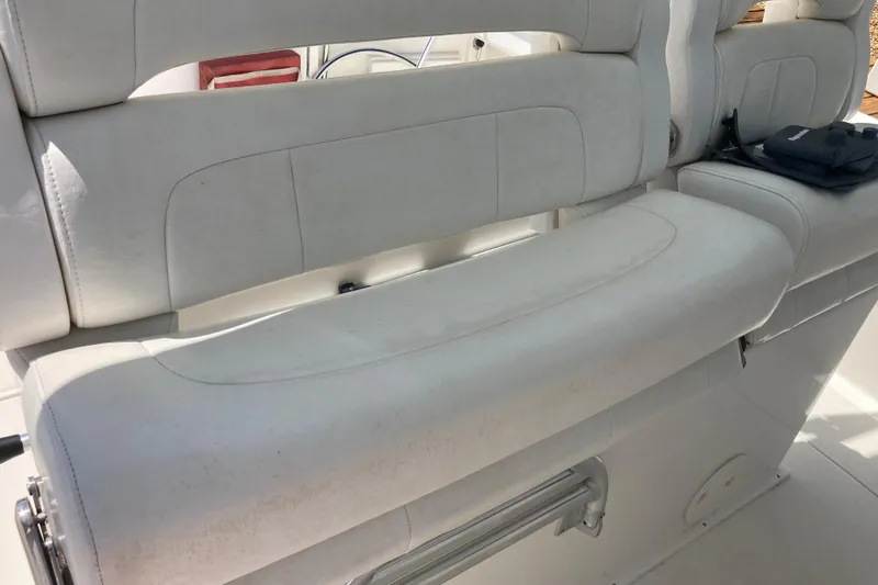  Yacht Photos Pics White seating on a 2016 Tarpon 326 boat, featuring cushioned upholstery.