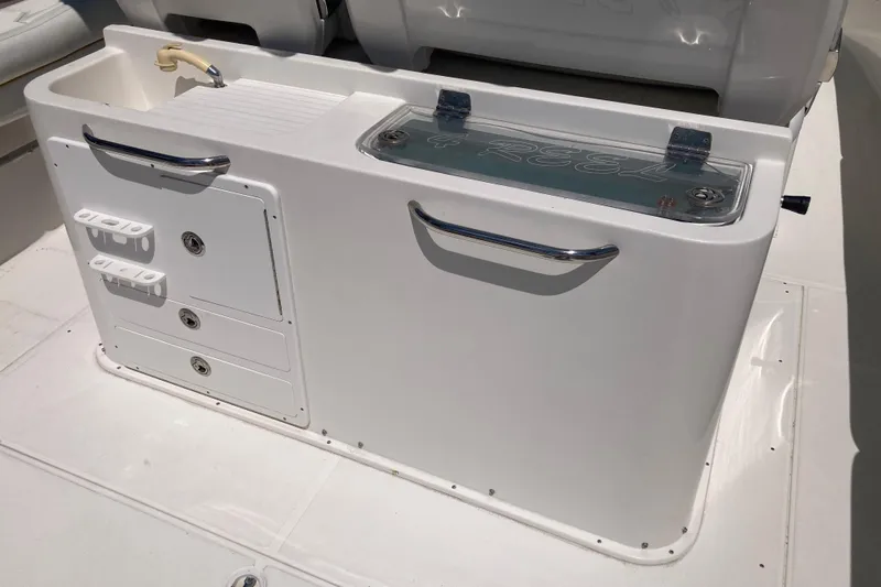  Yacht Photos Pics 2016 Tarpon 326 boat console with storage compartments and sink.