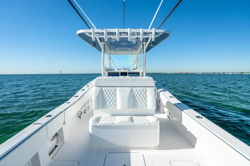  Yacht Photos Pics Manufacturer Provided Image: 2025 Invincible 36 Open Fisherman boat on calm ocean waters under clear blue sky.