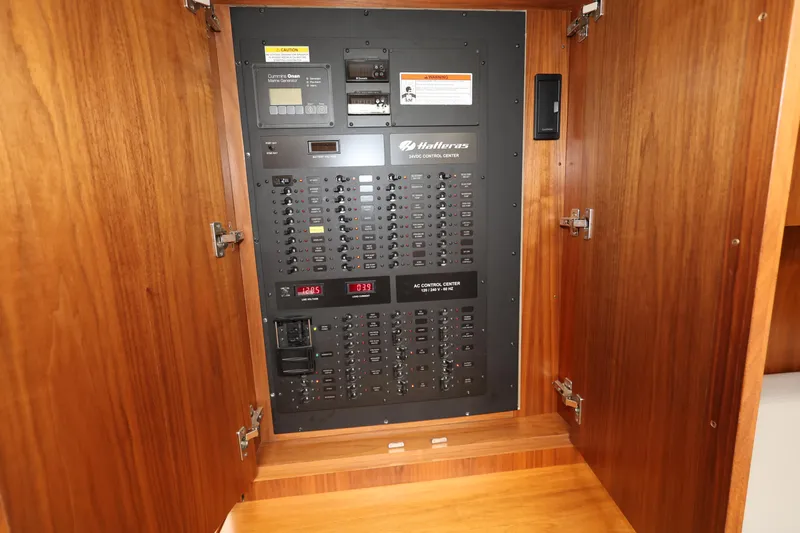  Yacht Photos Pics Electrical panel inside 2018 Hatteras 45 Express Sportfish yacht, featuring circuit breakers.