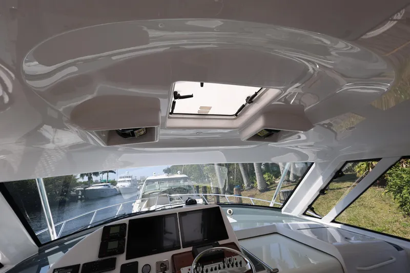  Yacht Photos Pics Interior view of 2018 Hatteras 45 Express Sportfish boat cockpit with navigation equipment.