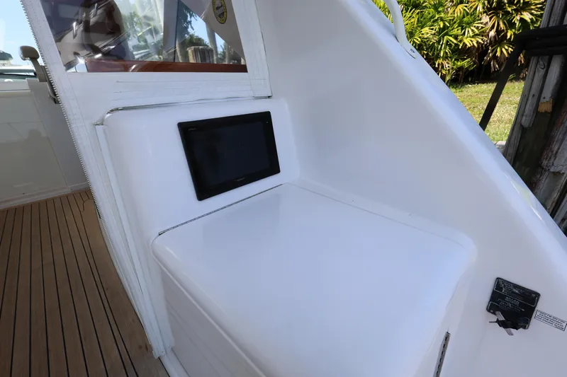  Yacht Photos Pics 2018 Hatteras 45 Express Sportfish interior detail with seating and wooden flooring.