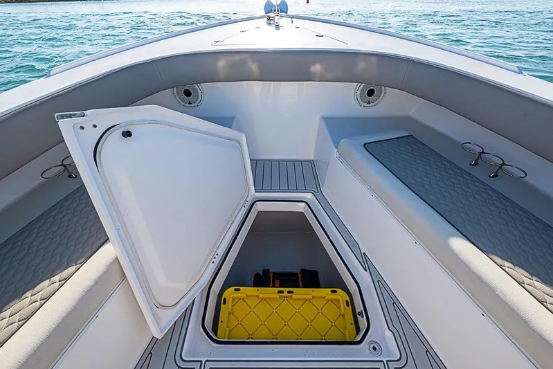  Yacht Photos Pics 2021 Albury Brothers 33 boat interior with open storage compartment and seating.