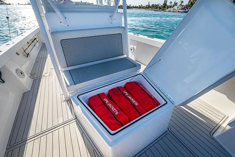  Yacht Photos Pics 2021 Albury Brothers 33 boat with open storage compartment containing life jackets.