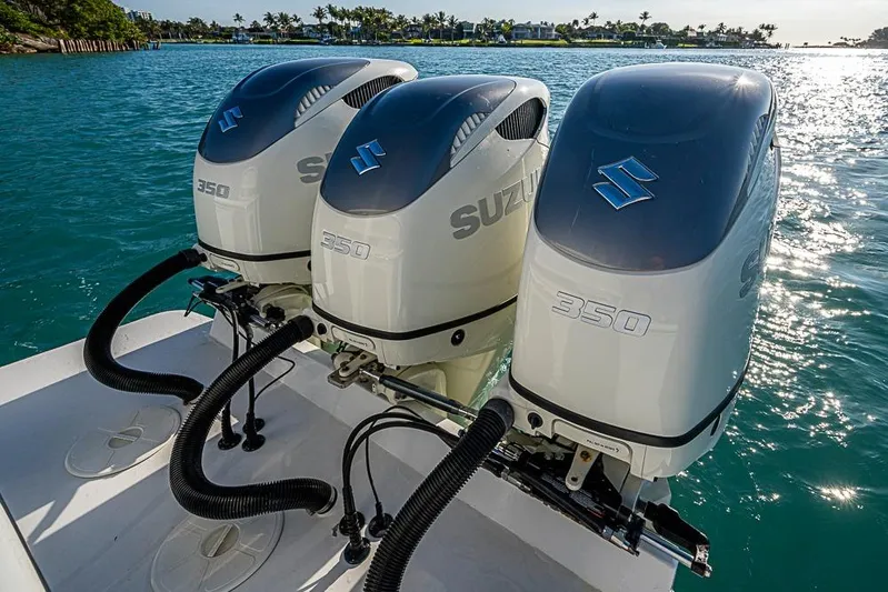  Yacht Photos Pics Triple Suzuki 350 outboard engines on a 2021 Albury Brothers 33 boat in sunny waters.