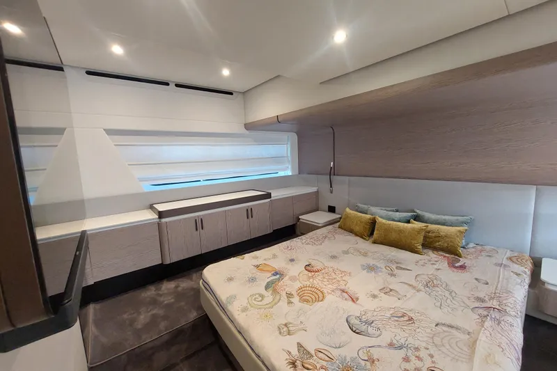El Bibes Yacht Photos Pics Luxurious bedroom interior of 2023 Azimut Fly 53 yacht with modern design and elegant decor.