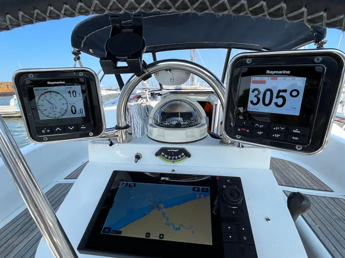 Vita Amoris Yacht Photos Pics Cockpit of 2005 Beneteau 423 sailboat with navigation instruments and compass.