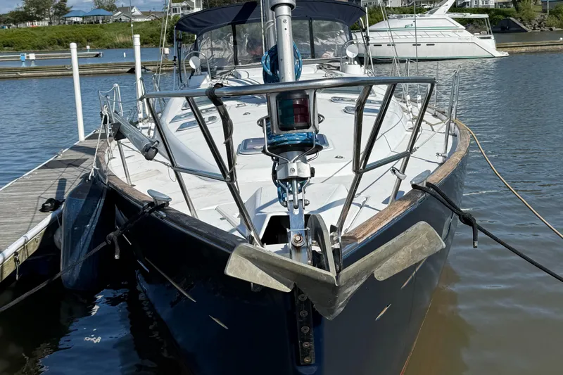 Vita Amoris Yacht Photos Pics 2005 Beneteau 423 sailboat docked at marina, front view with anchor and railing.