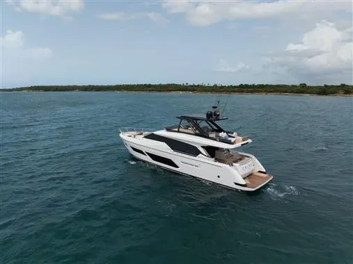  Yacht Photos Pics 2023 Ferretti Yachts 720 cruising on open water under a cloudy sky.