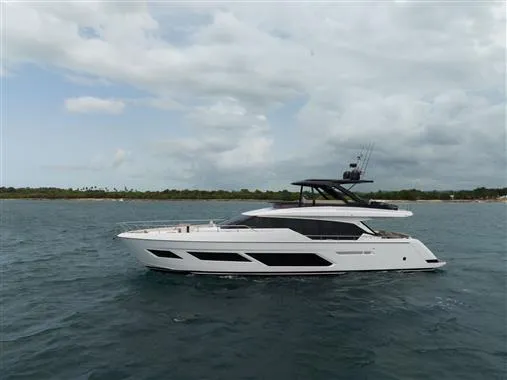  Yacht Photos Pics 2023 Ferretti Yachts 720 cruising on open water under cloudy skies.