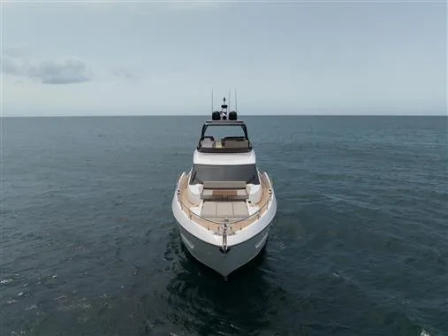  Yacht Photos Pics 2023 Ferretti Yachts 720 on open sea, showcasing sleek design and luxury features.