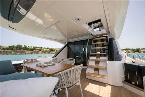  Yacht Photos Pics 2023 Ferretti Yachts 720, elegant outdoor seating and staircase, luxury yacht design.