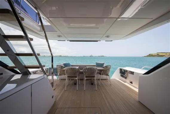  Yacht Photos Pics Luxurious 2023 Ferretti Yachts 720 deck with ocean view and elegant seating area.