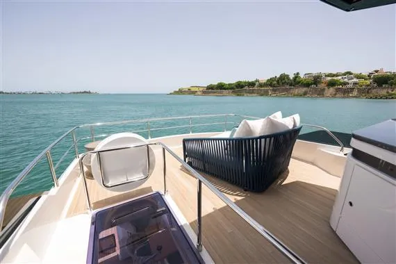  Yacht Photos Pics Luxurious 2023 Ferretti Yachts 720 deck with ocean view and modern seating.