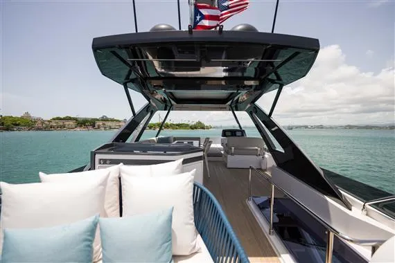  Yacht Photos Pics 2023 Ferretti Yachts 720 on water, featuring luxurious deck and seating area.