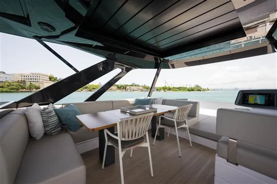  Yacht Photos Pics Luxurious 2023 Ferretti Yachts 720 interior with elegant seating and scenic ocean view.