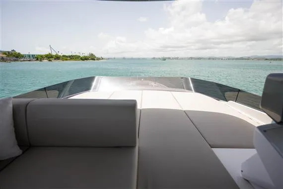  Yacht Photos Pics 2023 Ferretti Yachts 720 deck view with ocean backdrop and clear skies.