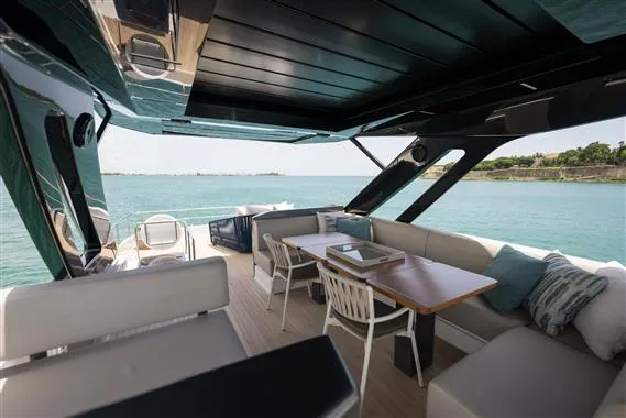  Yacht Photos Pics Luxurious 2023 Ferretti Yachts 720 interior with elegant seating and ocean view.