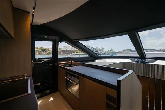  Yacht Photos Pics Interior of 2023 Ferretti Yachts 720, featuring modern kitchen and panoramic windows.
