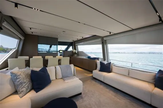  Yacht Photos Pics Luxurious interior of 2023 Ferretti Yachts 720 with elegant seating and ocean view.