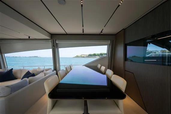  Yacht Photos Pics Luxurious interior of 2023 Ferretti Yachts 720 with ocean view and modern dining area.
