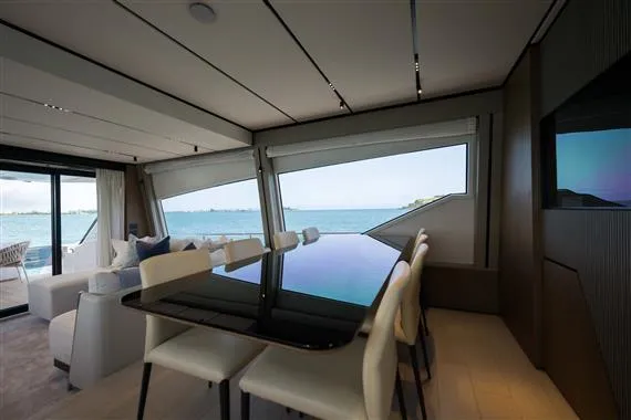 Yacht Photos Pics Luxurious interior of 2023 Ferretti Yachts 720 with ocean view through large windows.