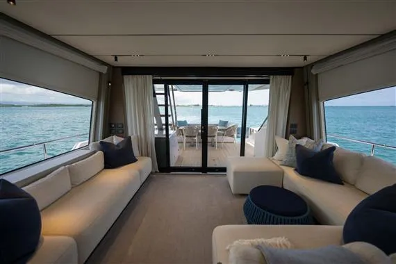  Yacht Photos Pics Luxurious interior of 2023 Ferretti Yachts 720 with ocean view and elegant seating.