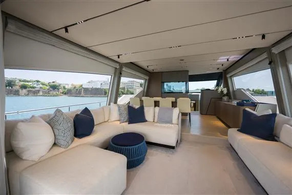  Yacht Photos Pics Luxurious interior of 2023 Ferretti Yachts 720 with elegant seating and panoramic windows.